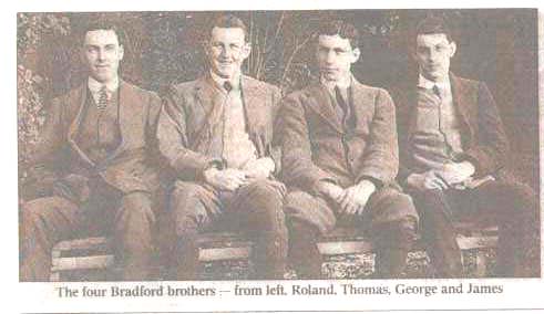 Pic of all 4 brothers sitting on park bench